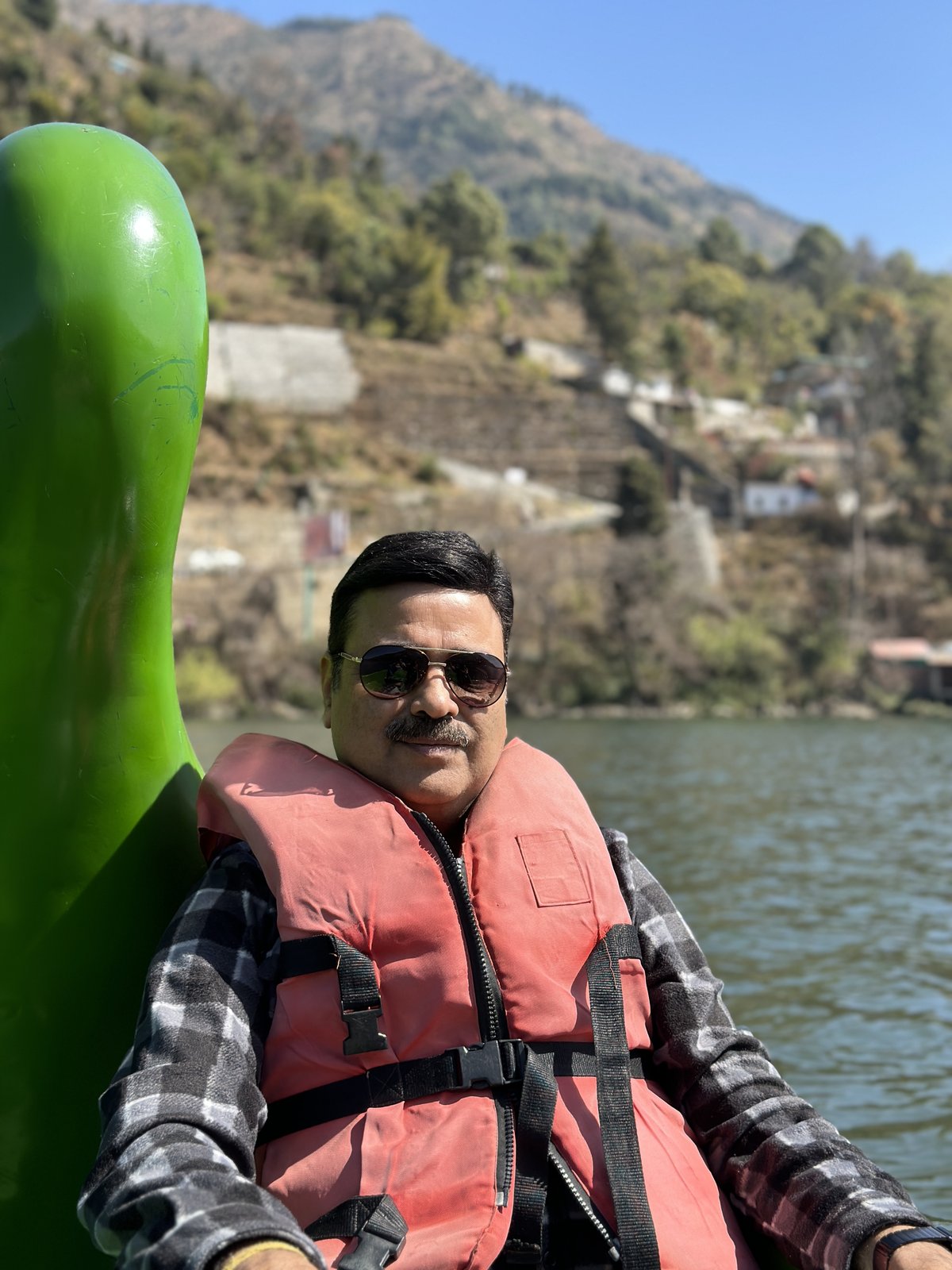 Gaurav Ghulati wearing a life jacket during a lake ride.