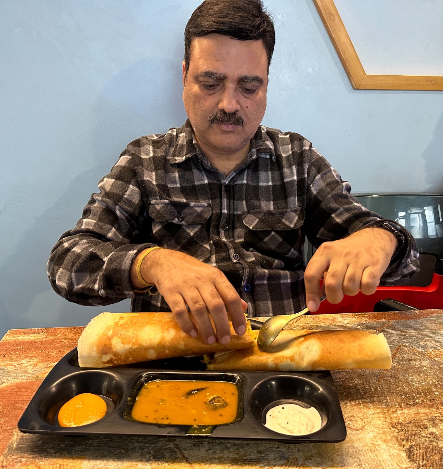 Gaurav Ghulati enjoying a meal while traveling.